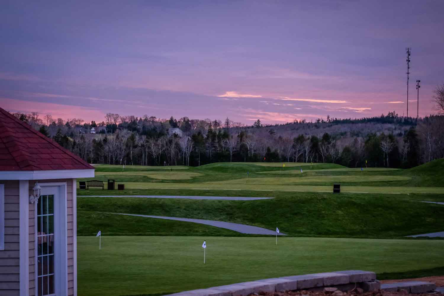 An elegant golf course under a graceful sunset, embodying the distinctive Kolf Maison experience